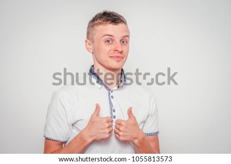 The man's hand shows a gesture of approval. Thumbs up. The hand shows gesture class. Everything is cool, you're done, praise, everything is OK, wonderful mood.