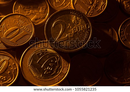Coins of Brazil money (real money) and Euro coin.
