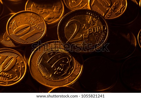 Coins of Brazil money (real money) and Euro coin.