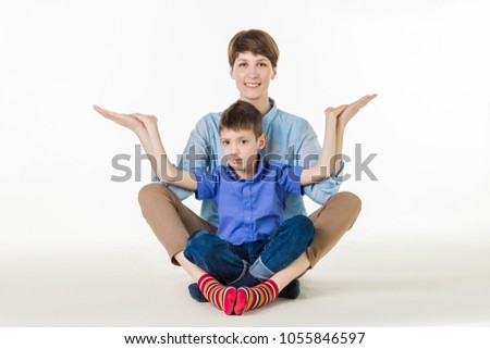mother and son doing yoga or sports exercises. Fit family and good time together. isolated on white. the concept of a healthy lifestyle and smiling happy family