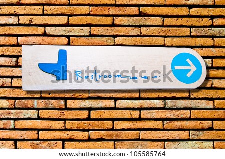 The Sign of restroom on wall background