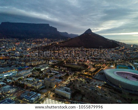 Cape Town and coast line, jetty. Are ships and boats, far mountain on the blue sky background. Summer. South Africa