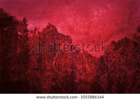 wall texture plaster and cement. old wall. grunge cracks. red sunset background
