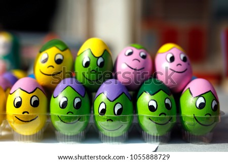Funny Easter eggs. Colorful painted eggs with funny faces. 