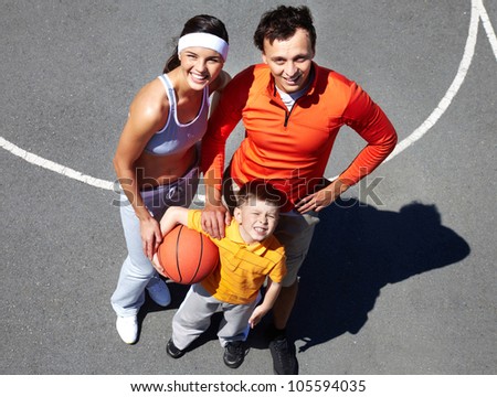 The above shot of a sportive family spending time outdoors in summer