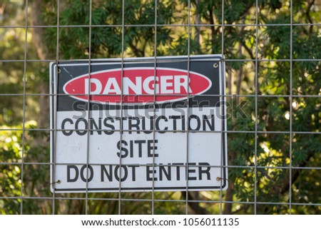 Signboard of danger at construction site.