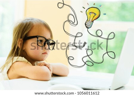 Light Bulb with little girl using her laptop