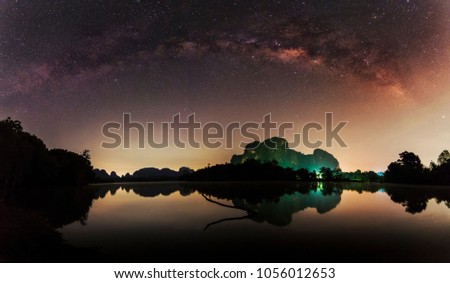 Landscape of Milky Way in night sky galaxy with stars and space dust in the universe background , thailand , long exposure ,low light