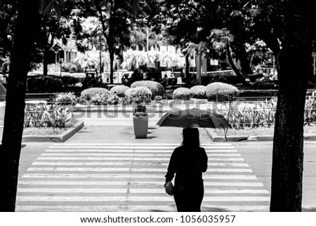 Photo of a woman in pedestrian crossing