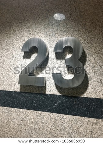 Stainless steel assembly is no.23 on granite wall.