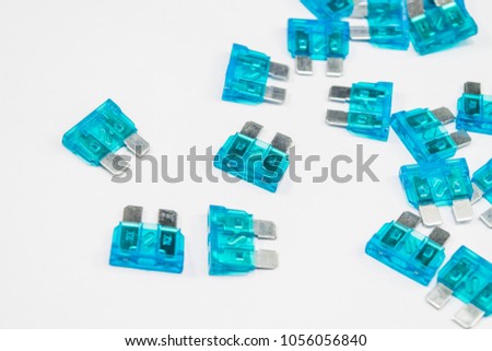 Electrical automotive fuses for car on white background
