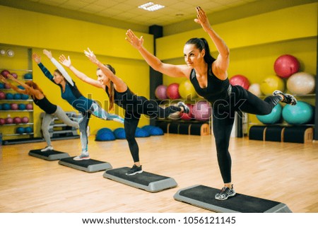Women group on step aerobic workout