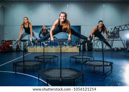 Women group on sport trampoline, fitness workout Royalty-Free Stock Photo #1056121214
