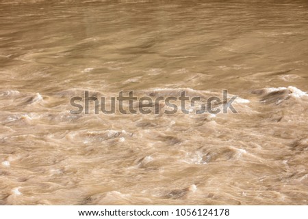 
Turbid river flowing in the flow Royalty-Free Stock Photo #1056124178
