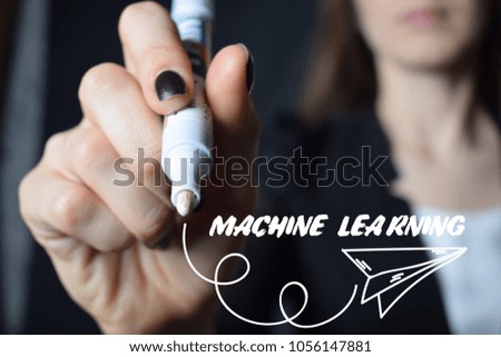 The businessman writes an inscription with a white marker:MACHINE LEARNING