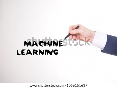 The businessman writes a black marker inscription:MACHINE LEARNING