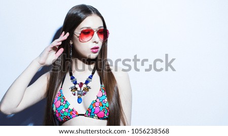 lifestyle, fahion and people concept: lovely fashion model girl with bright make up and long hair.