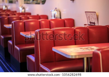 Red seats in a american restaurant Royalty-Free Stock Photo #1056282698