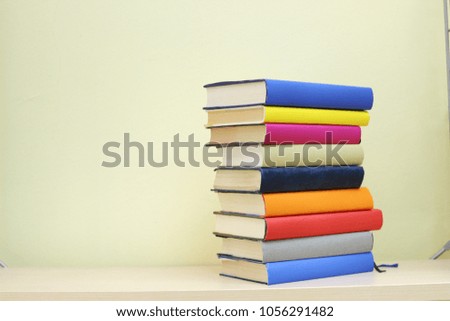 Stack of book on the shelf in library