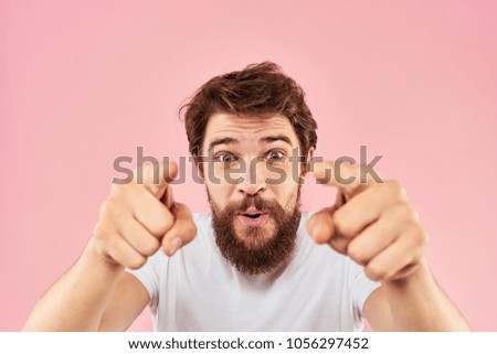 cute man with a beard showing his fingers                              