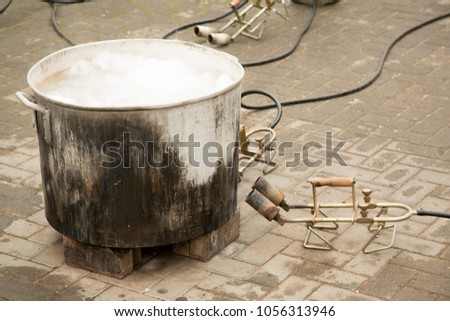 Public tank with boiling water for religious dishes cleaning before the holiday of Pesach / Passover. Kosher for pesah. Hagalat kelim for Passover