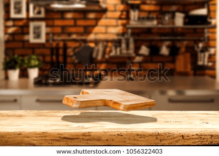 Kitchen wooden board in air and kitchen interior with free space for your decoration 