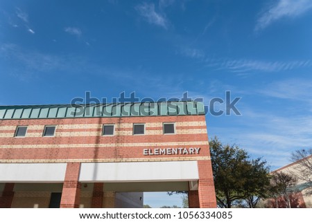Typical public facade of elementary school campus in Texas, USA blue sky.