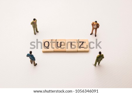 Miniature figures businessman : meeting on quiz letters by wooden block word on white paper background, in concept of business and corporation