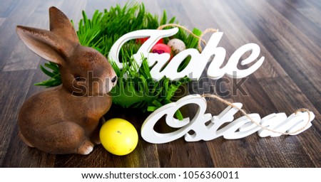 Easter bunny in front of nest and eggs, happy Easter, easter card greetings Frohe Ostern