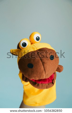 playing puppet on the white background. Giraffe. reaction. Emotional.