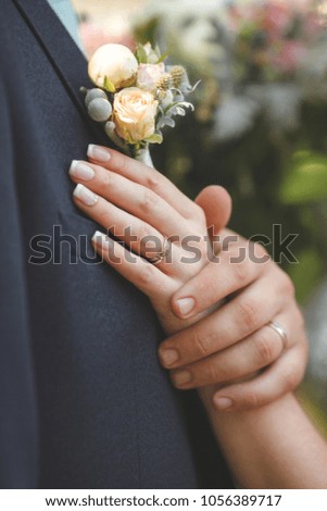 Picture of brides hand with ring on her finger
