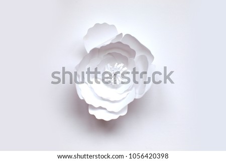 Handmade colorful paper cut flower on isolated white background for wedding invitation.