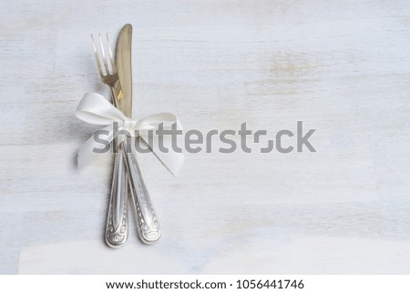 Silverware with white ribbon