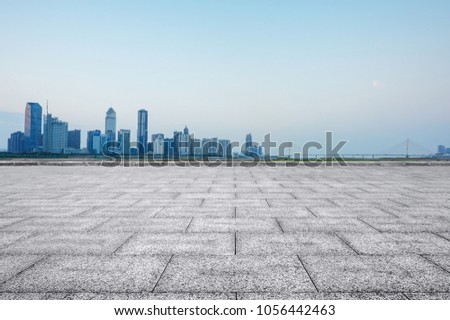 empty marble floor with cityscape and skyline in cloud sky 