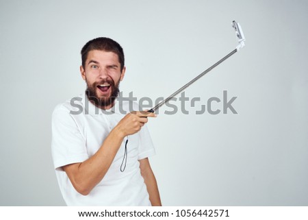 happy man with selfie stick                               