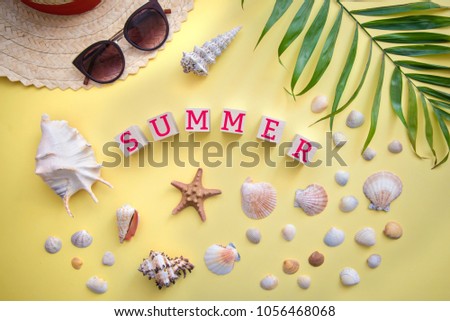 Summer mood in a bright yellow card about vacation at sea: shells, sunglasses, starfish, beach hat, palm tree, top view