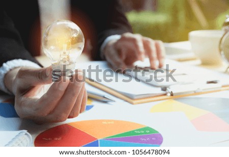 Hand of person holding light bulb for idea and success. Innovation and creative concept.