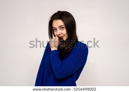 Cute beautiful girl in different poses shows different emotions on different backgrounds in different clothes