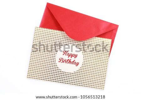 Top view Happy Birthday greeting card with red envelop isolated on white background