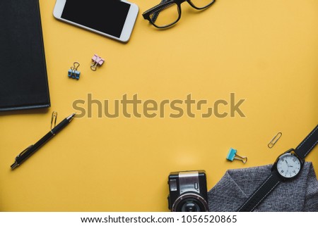 Home office stuff with notebook, camera and other supplies. Flat lay photo. Top view. Freelance concept