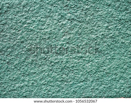 Old light blue cement background, rough texture of concrete wall