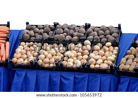 Ripe beets and onions in shop in a box