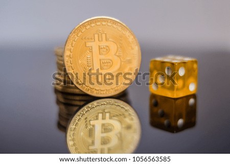 gold bitcoin with dices on white background