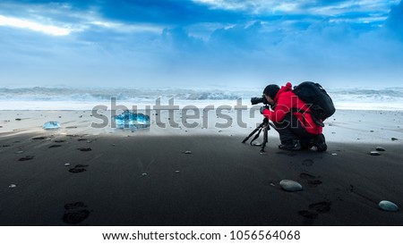 Photographer take a photo at ice in Iceland.
