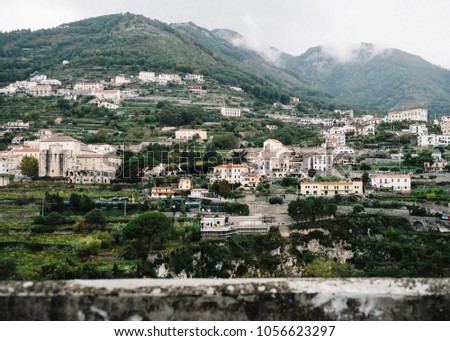 Houses build against the hills, mountains in Ravello Italy. Shot on film.
