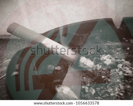 Sign - forbidden smoking, Prohibition sign, in the background lit a cigarette fire, double exposure, blurred image.