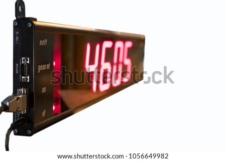 Industrial 7 Segment Display Unit, With RED color numeric value, Selective focused on cable connected to Serial RS232 and free RS485 communication port. Isolated on White Background With Clipping Path