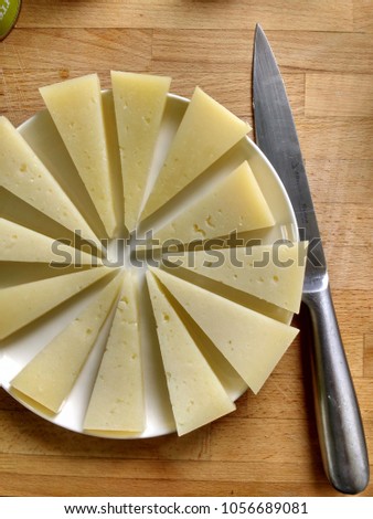 Spanish 'Manchego' cheese and knife from above 
