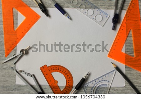 Geometry set with compass, ruler and protractor on white background,