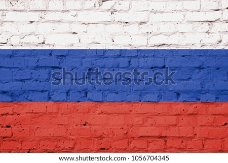 Texture of a flag of Russia on a brick wall.